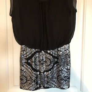 Sequined fitted dress, with black flowy top.